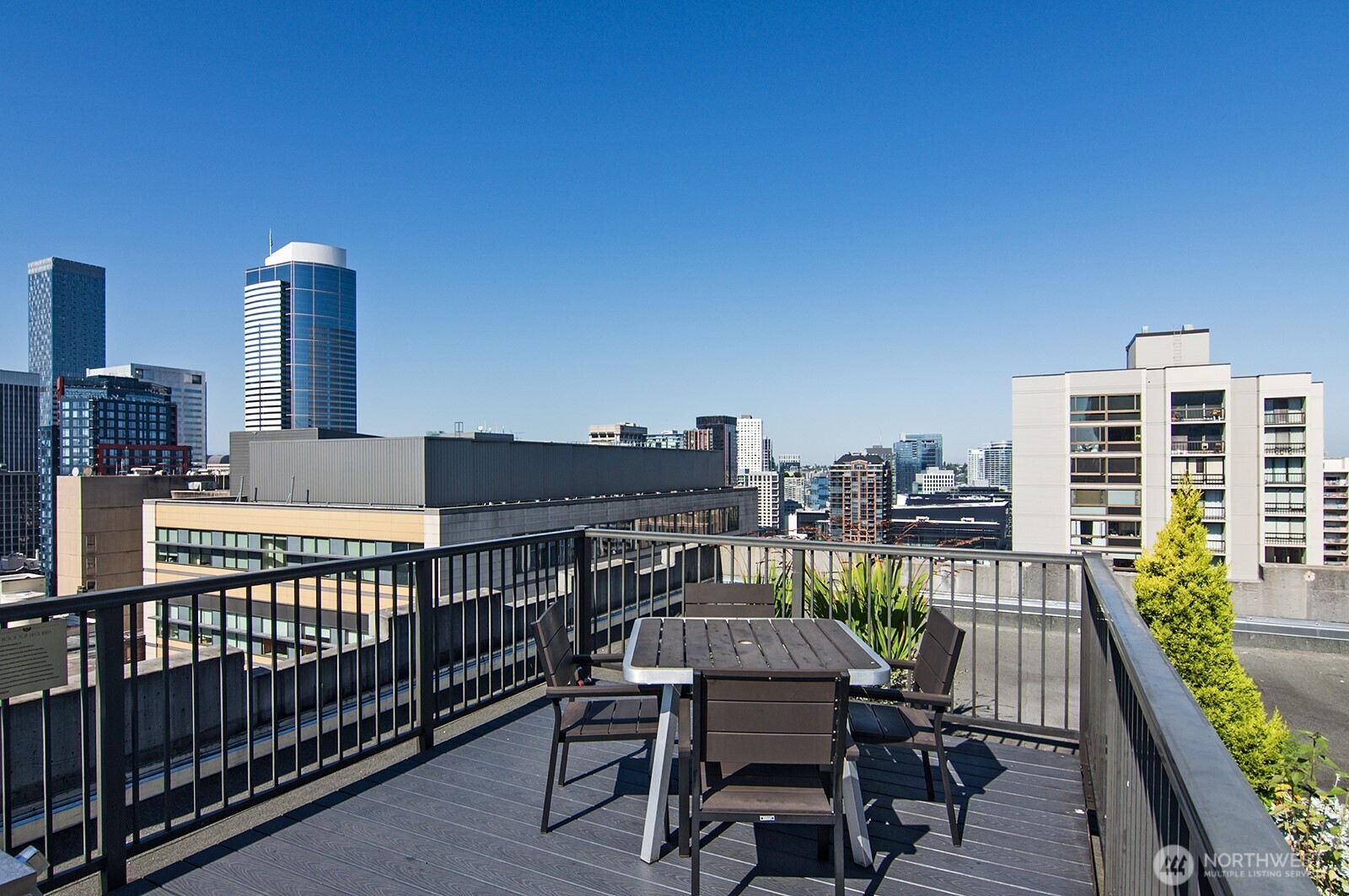 1105 Spring Street, Unit 709 Seattle, WA 98104 - Photo 22 of 30 a view of a balcony with two chairs and a table