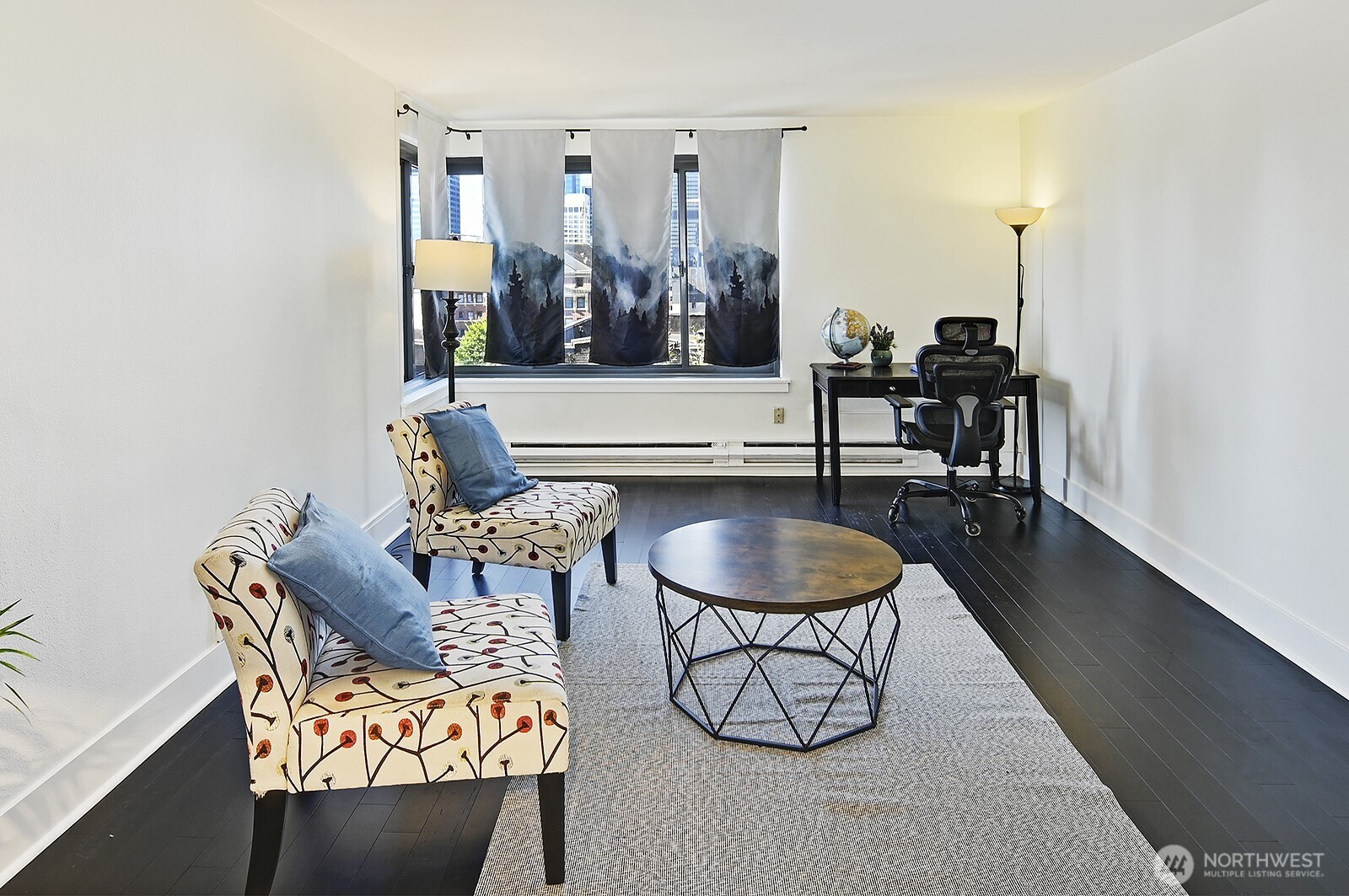 1105 Spring Street, Unit 709 Seattle, WA 98104 - Photo 5 of 30 a living room with furniture and wooden floor