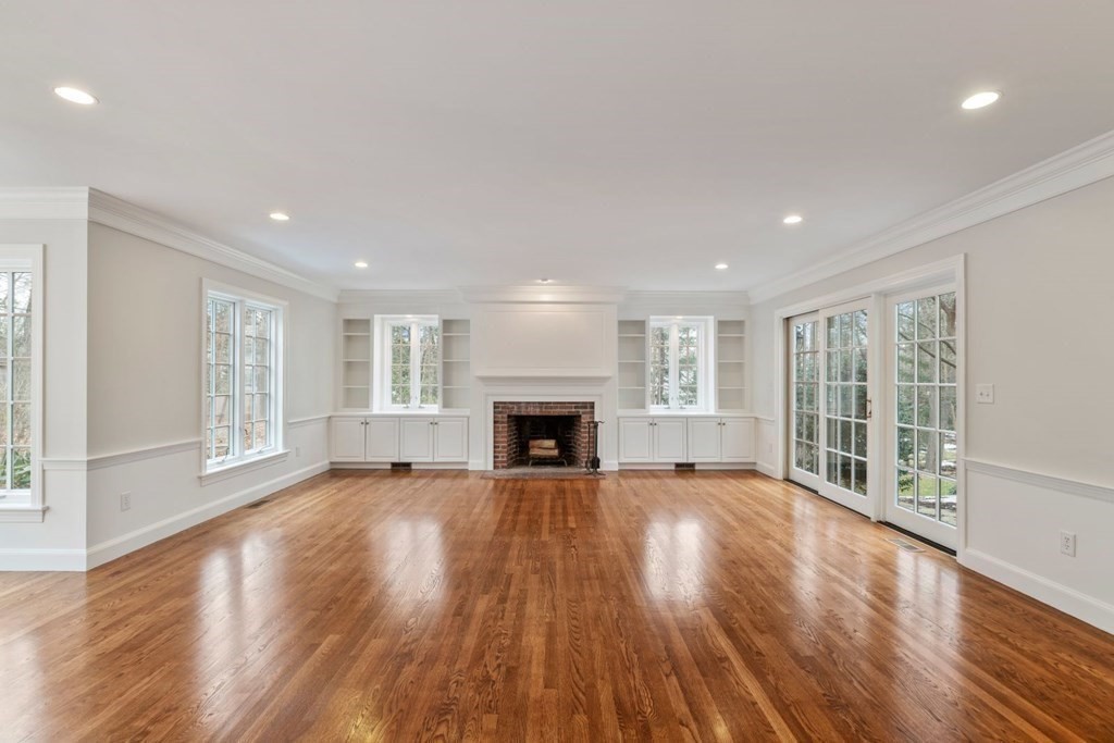 32 Peirce Road Wellesley, MA 02481 - Photo 20 of 40 a view of an empty room with wooden floor and a window