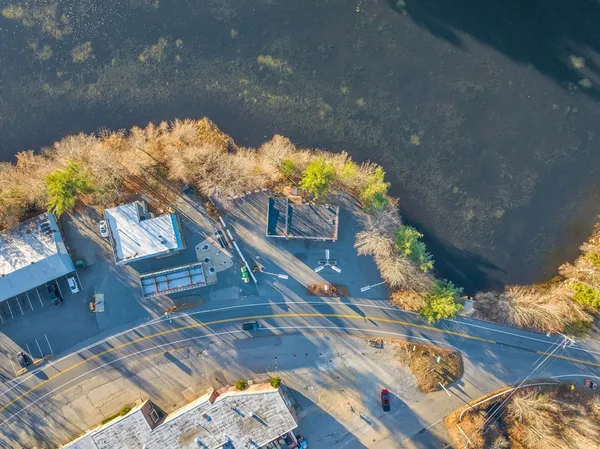 an aerial view of a house with a yard