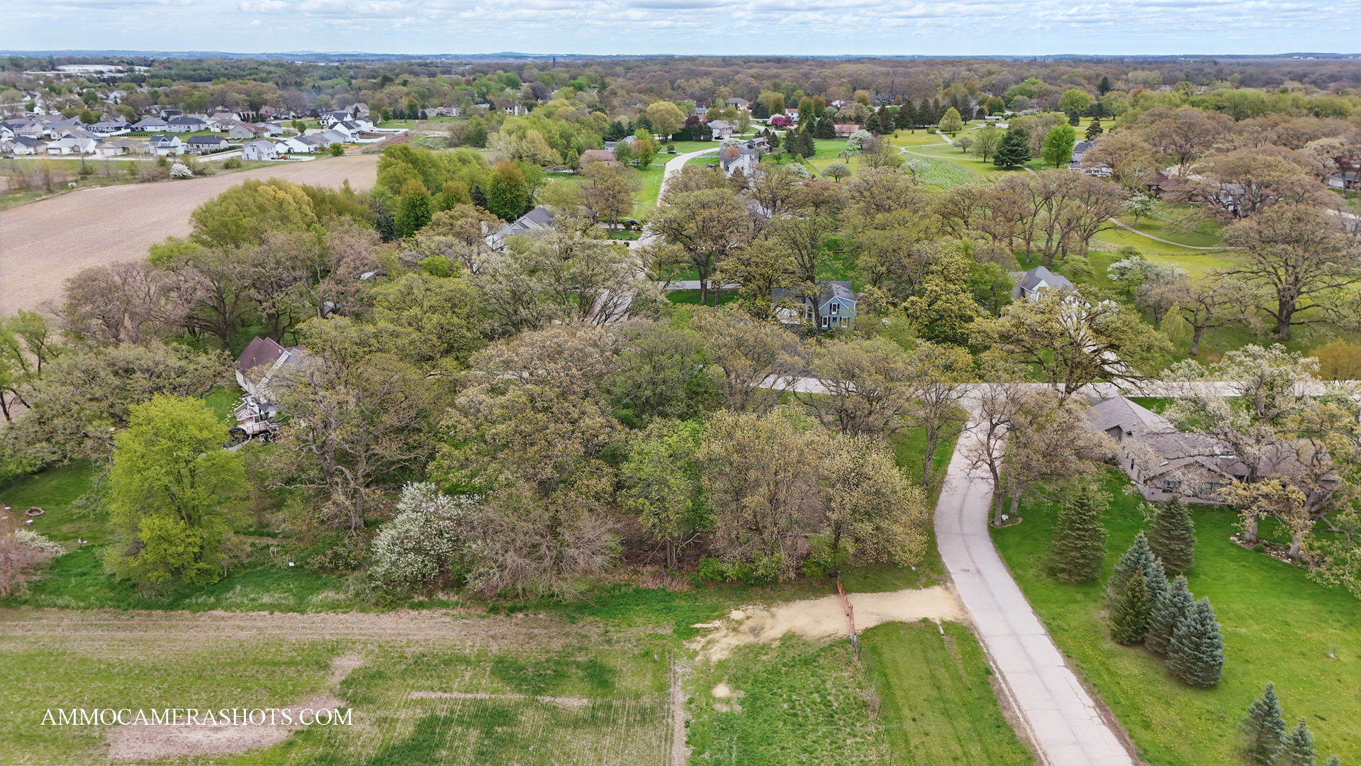 Lot 3 Ellwood Greens Road Genoa, IL 60135 - Photo 15 of 20 an aerial view of residential houses with outdoor space and trees