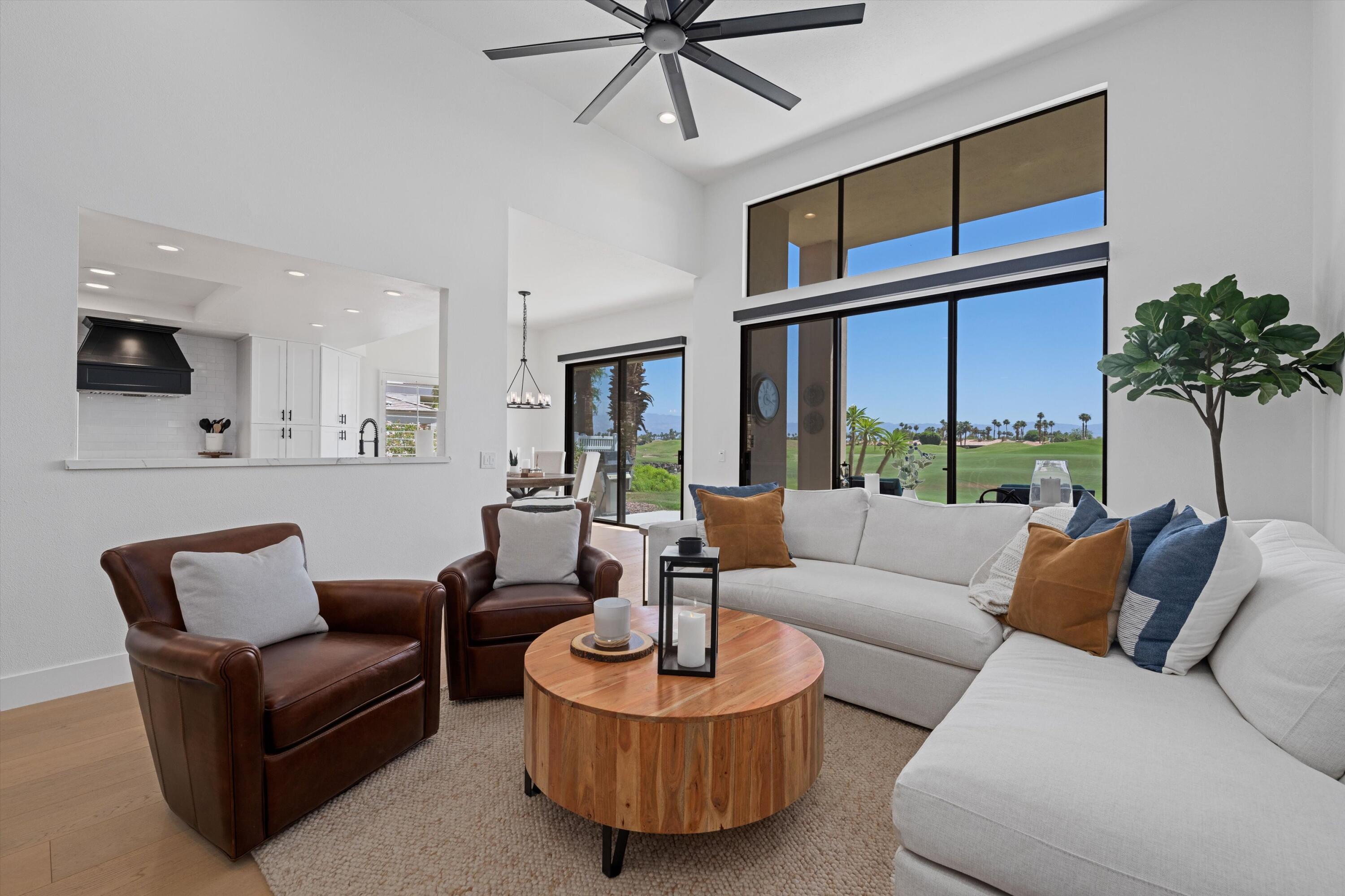 54754 Oak-Tree La Quinta, CA 92253 - Photo 15 of 33 a living room with furniture and a large window