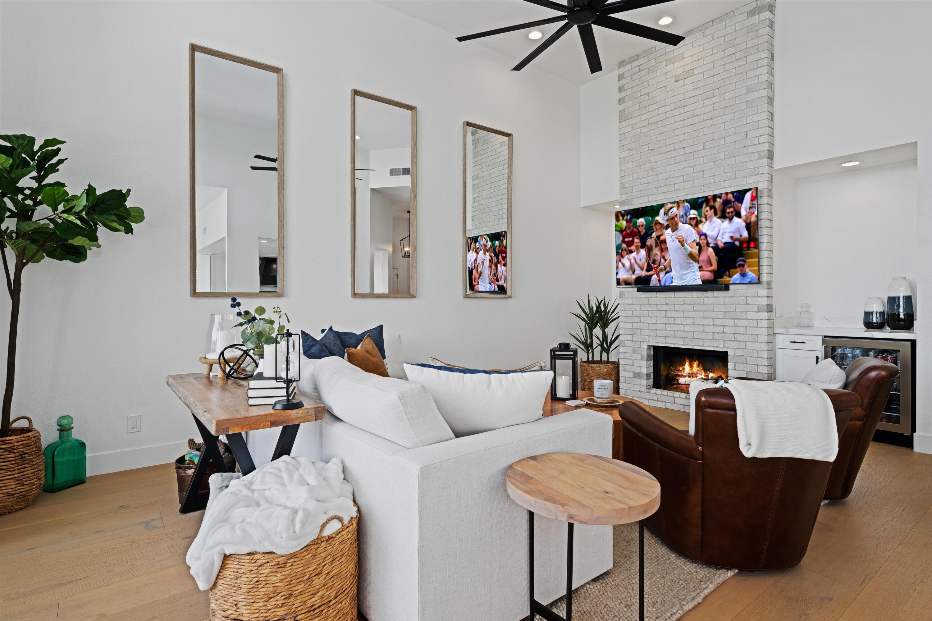 54754 Oak-Tree La Quinta, CA 92253 - Photo 16 of 33 a living room with furniture potted plant and a fireplace