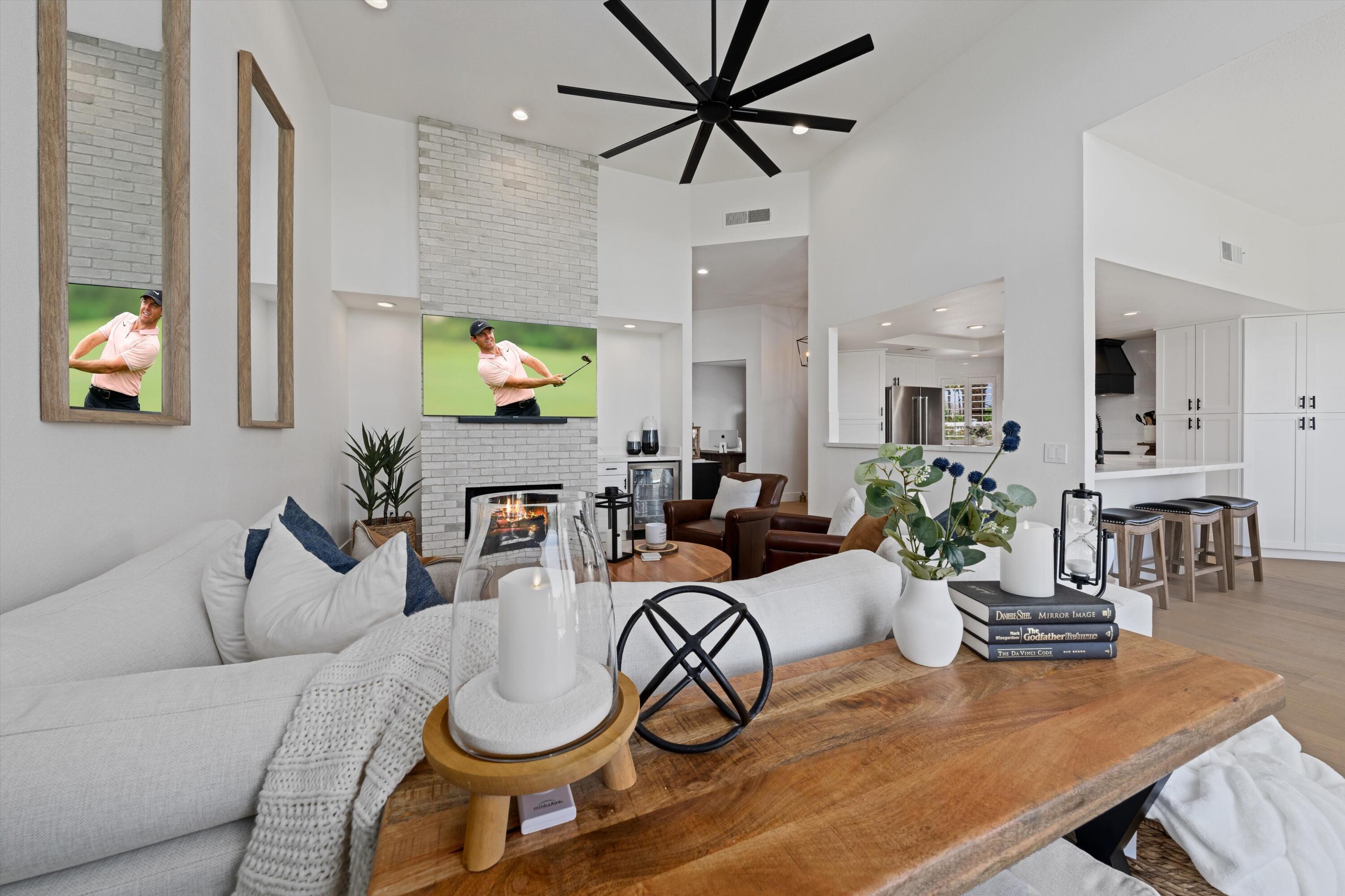 54754 Oak-Tree La Quinta, CA 92253 - Photo 17 of 33 a living room with furniture a flat screen tv and a large window