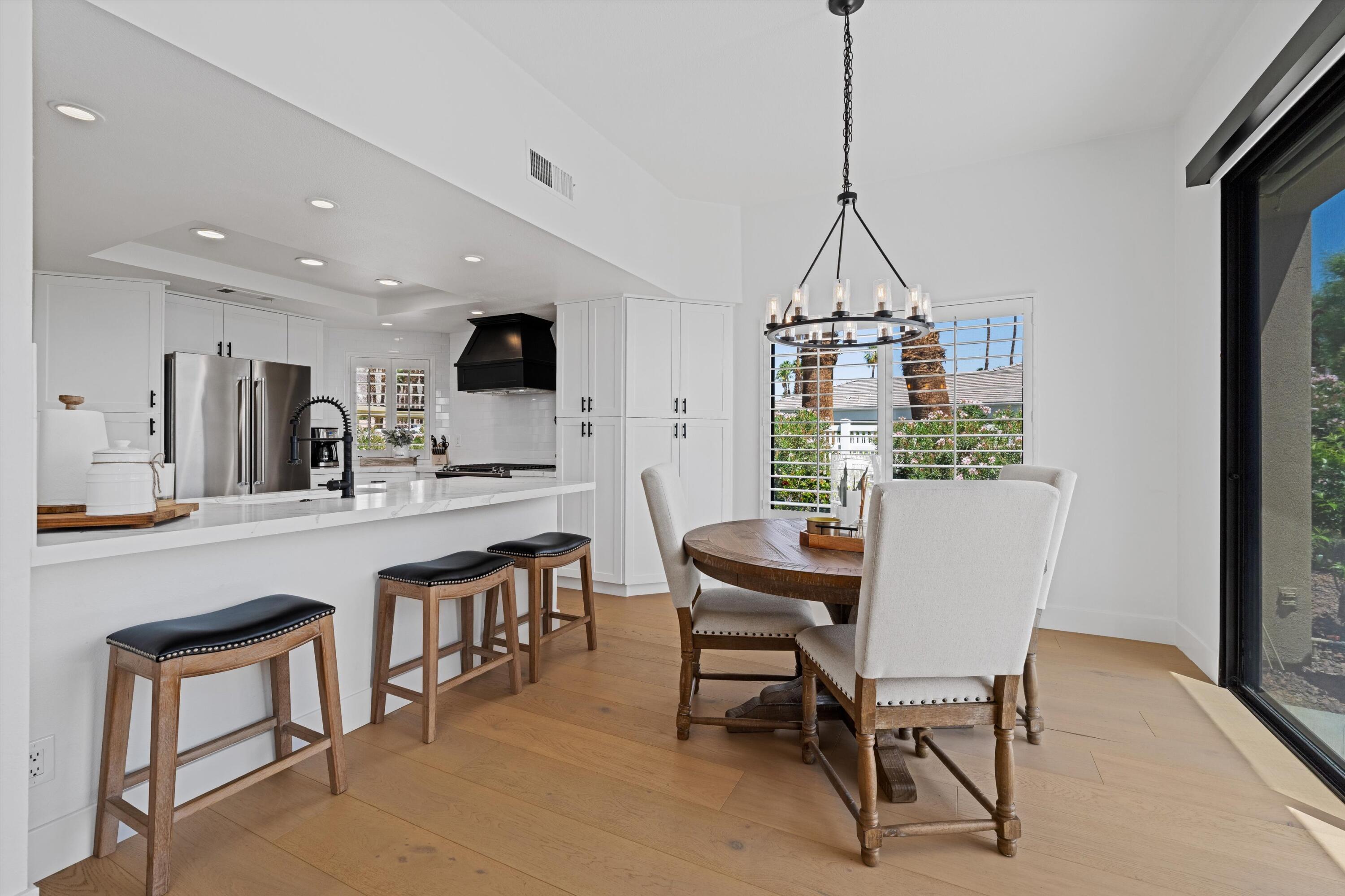 54754 Oak-Tree La Quinta, CA 92253 - Photo 18 of 33 a dining room with furniture and window