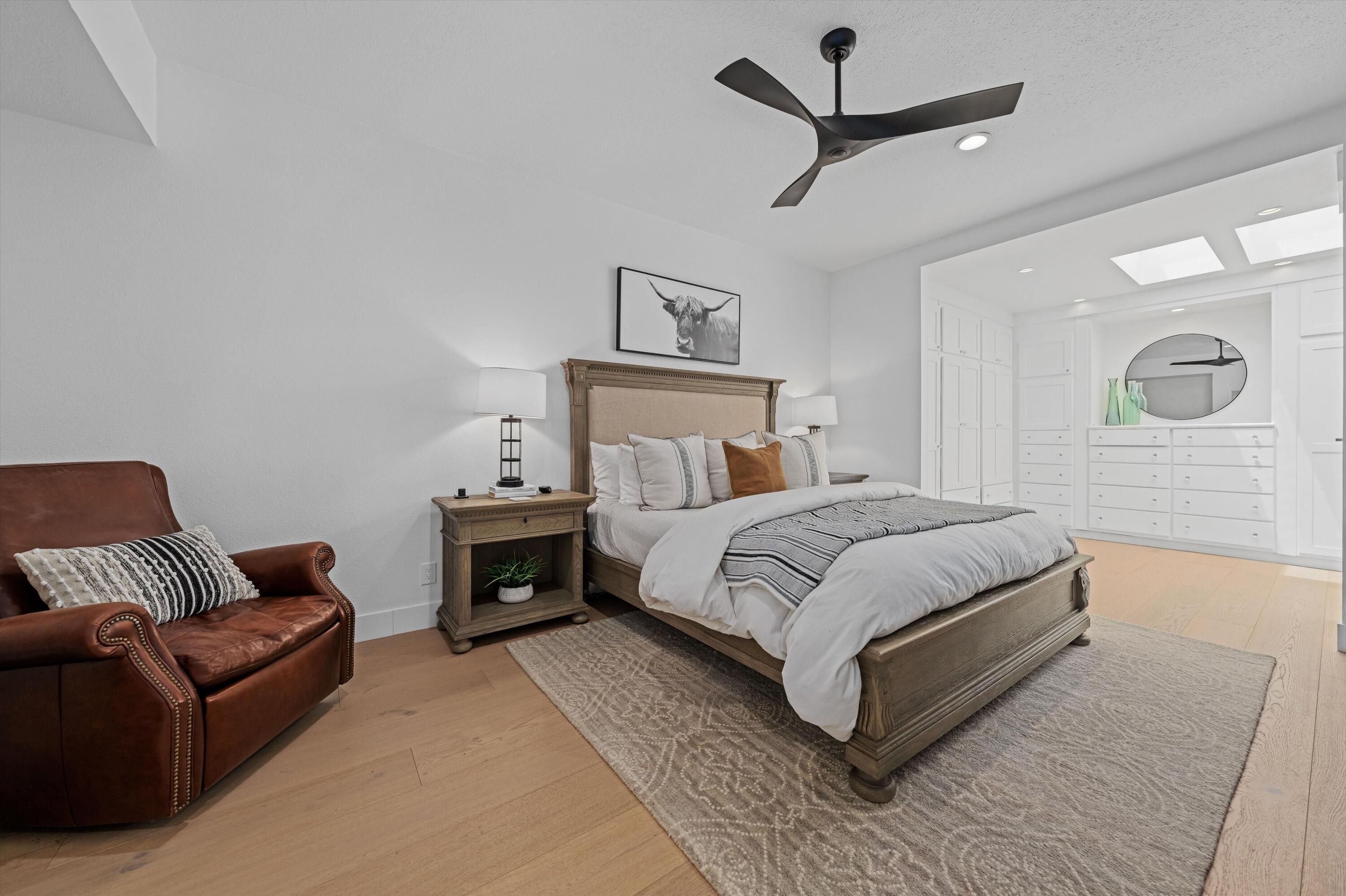54754 Oak-Tree La Quinta, CA 92253 - Photo 25 of 33 a bedroom with a bed couch and a ceiling fan