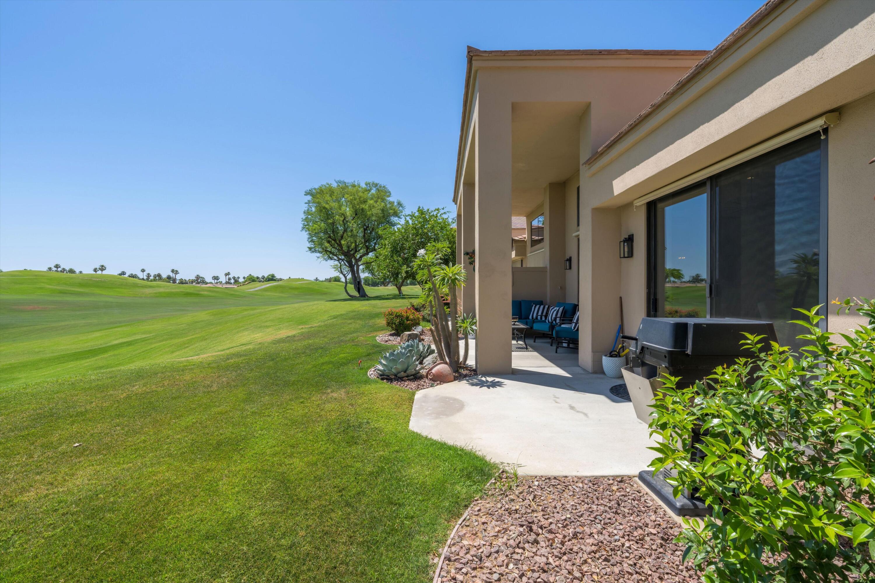 54754 Oak-Tree La Quinta, CA 92253 - Photo 8 of 33 a view of a house with a garden