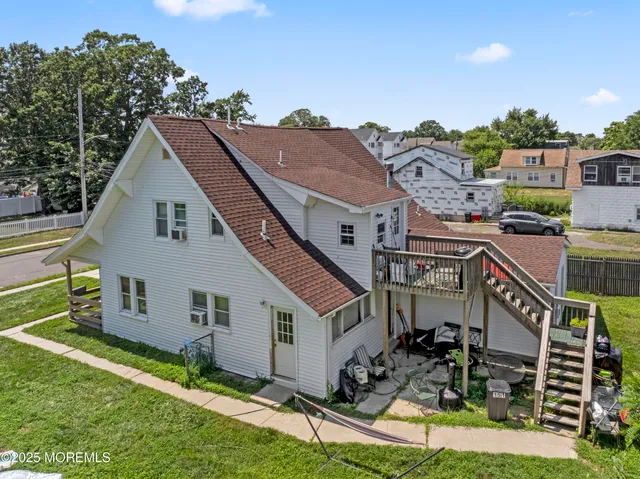 a aerial view of a house with a yard