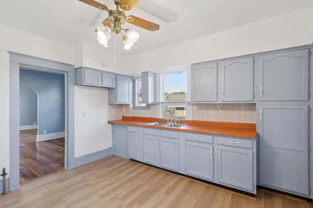 a kitchen with stainless steel appliances granite countertop a sink and cabinets