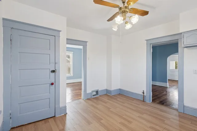 a view of empty room with wooden walls