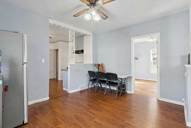 a kitchen with stainless steel appliances a stove a sink and a refrigerator