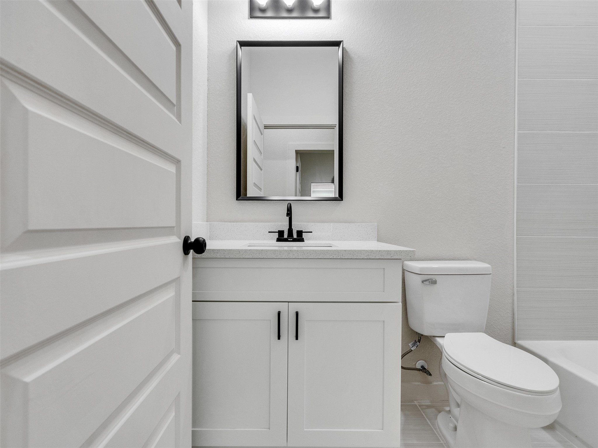 9709 Cargill Street, Unit AB Houston, TX 77029 - Photo 23 of 32 a bathroom with a sink a toilet and mirror