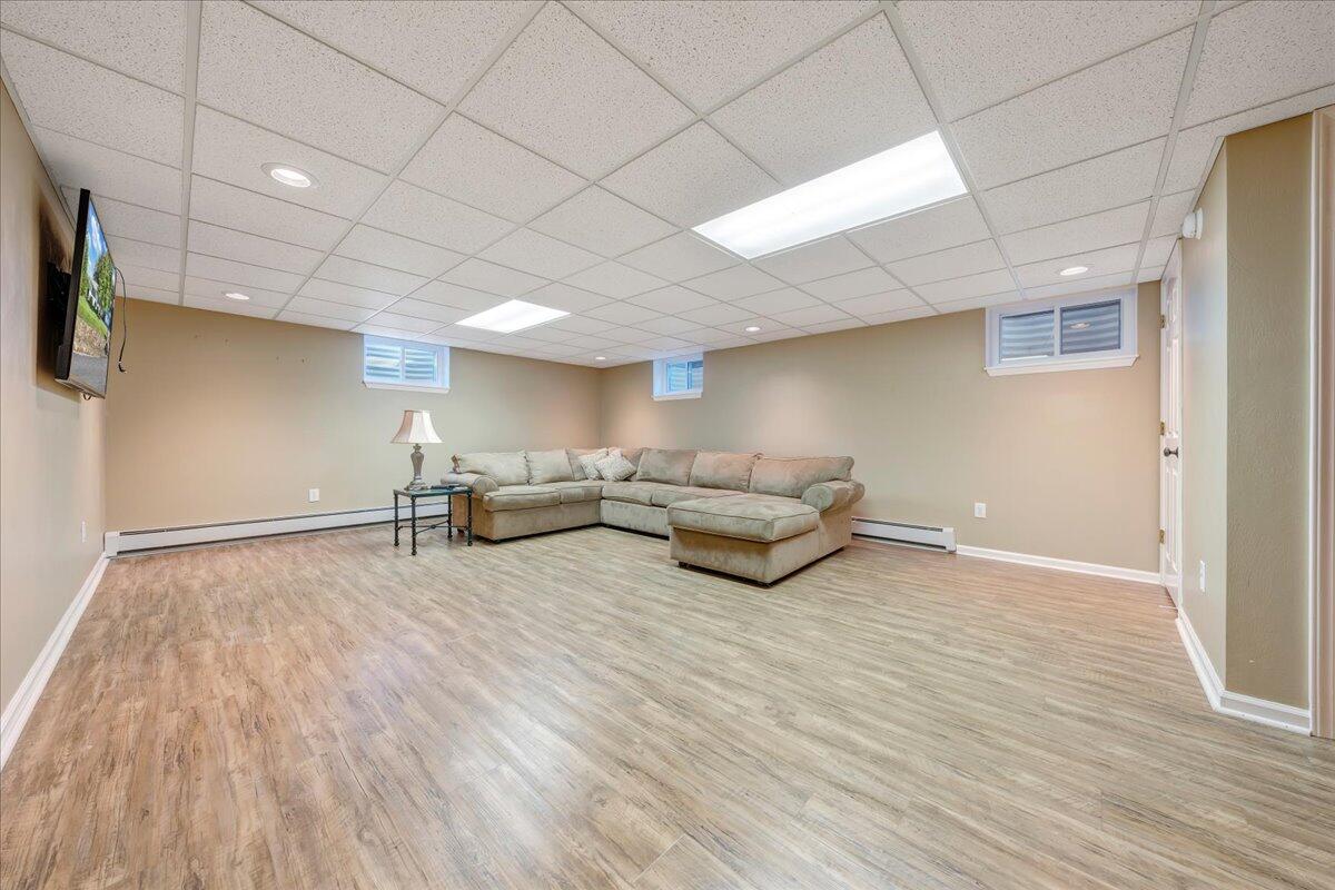 5588 Highfields Road Roanoke, VA 24018 - Photo 42 of 86 a living room with furniture and a wooden floor