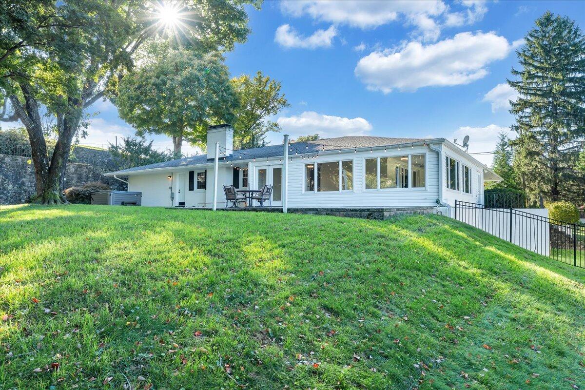 5588 Highfields Road Roanoke, VA 24018 - Photo 60 of 86 a view of a house with a yard and sitting area