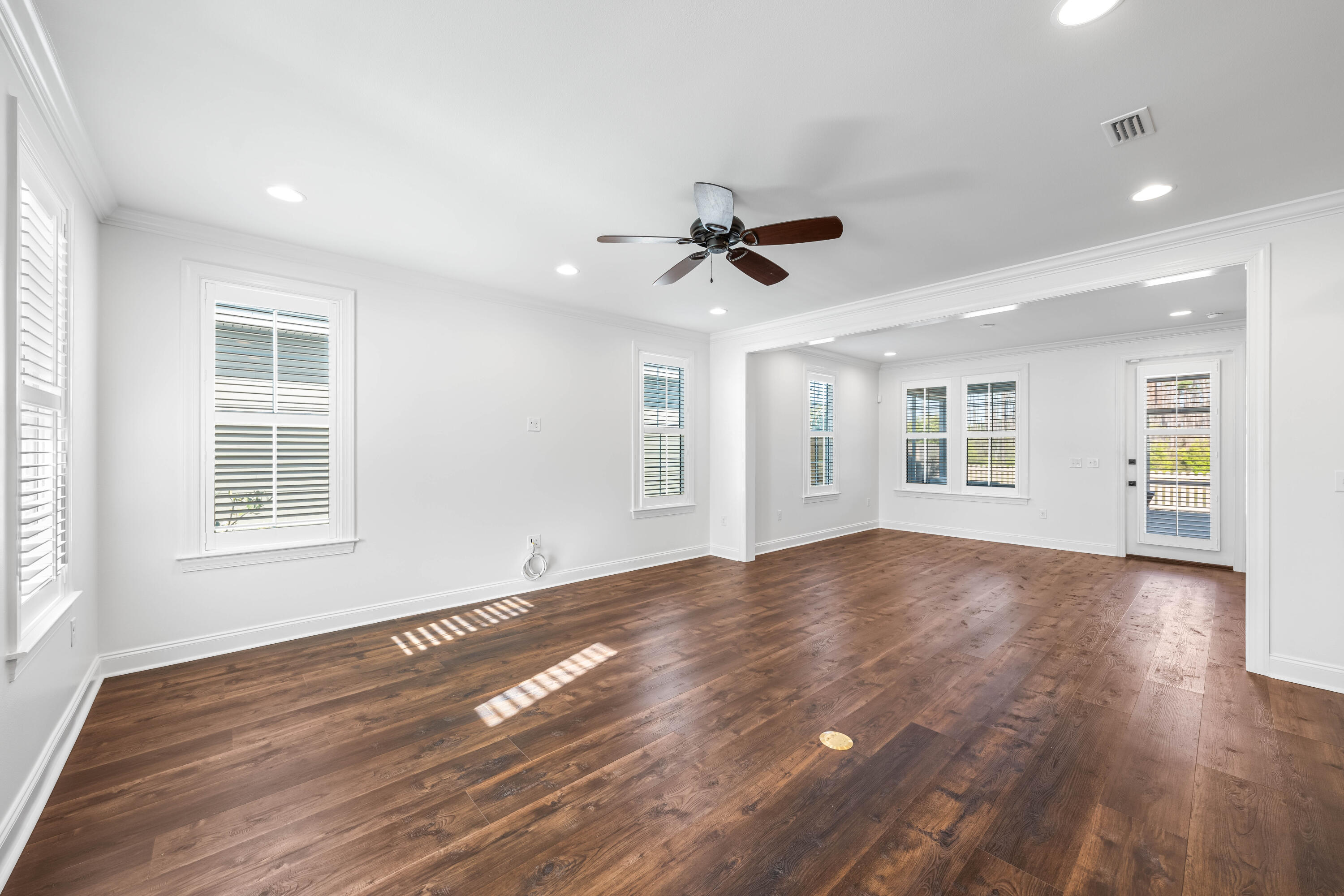 253 Windrow Way Watersound, FL 32461 - Photo 13 of 46 a view of empty room with wooden floor and fan