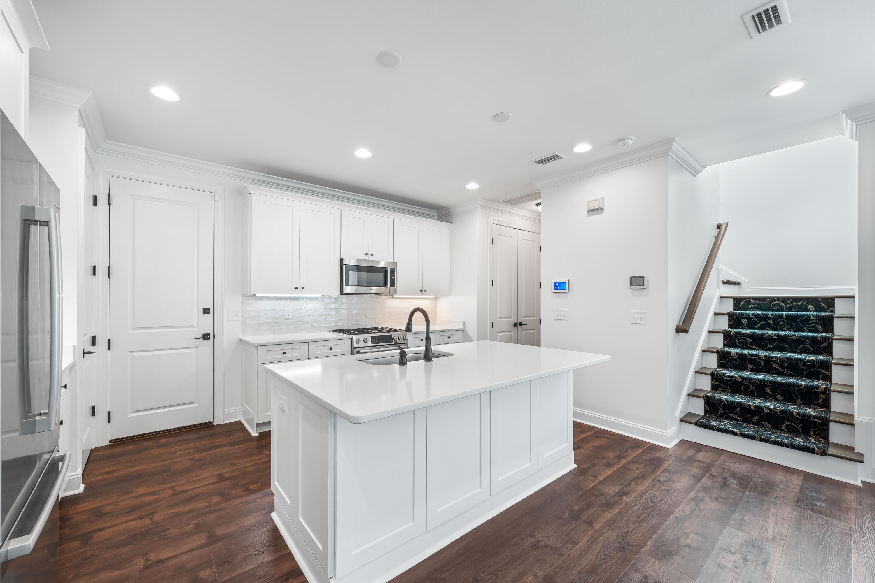253 Windrow Way Watersound, FL 32461 - Photo 16 of 46 a kitchen with sink refrigerator and stove