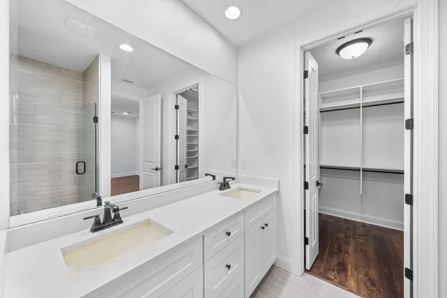 a view of walk in closet with empty racks