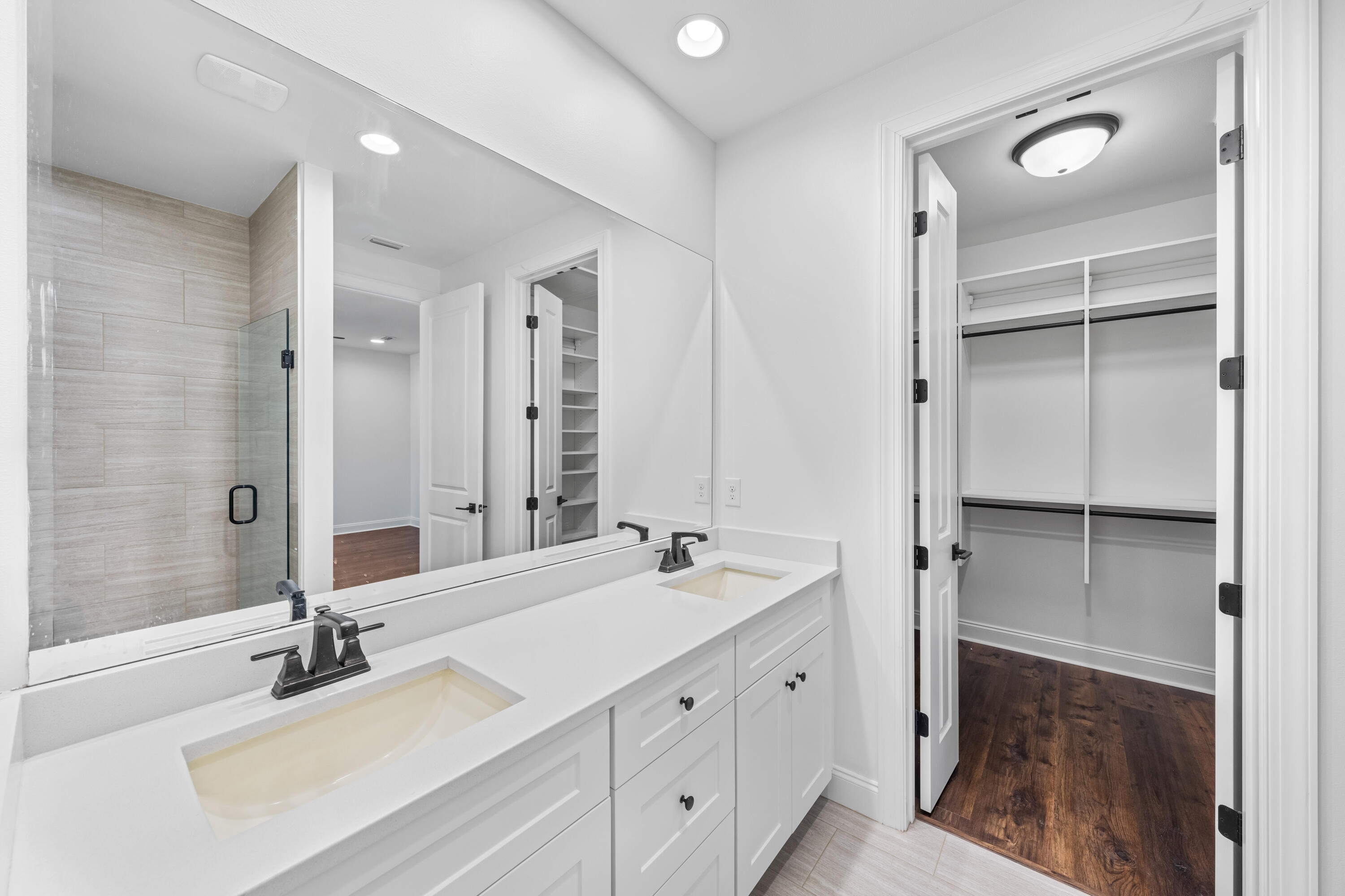 253 Windrow Way Watersound, FL 32461 - Photo 28 of 46 a bathroom with a tub sink and mirror