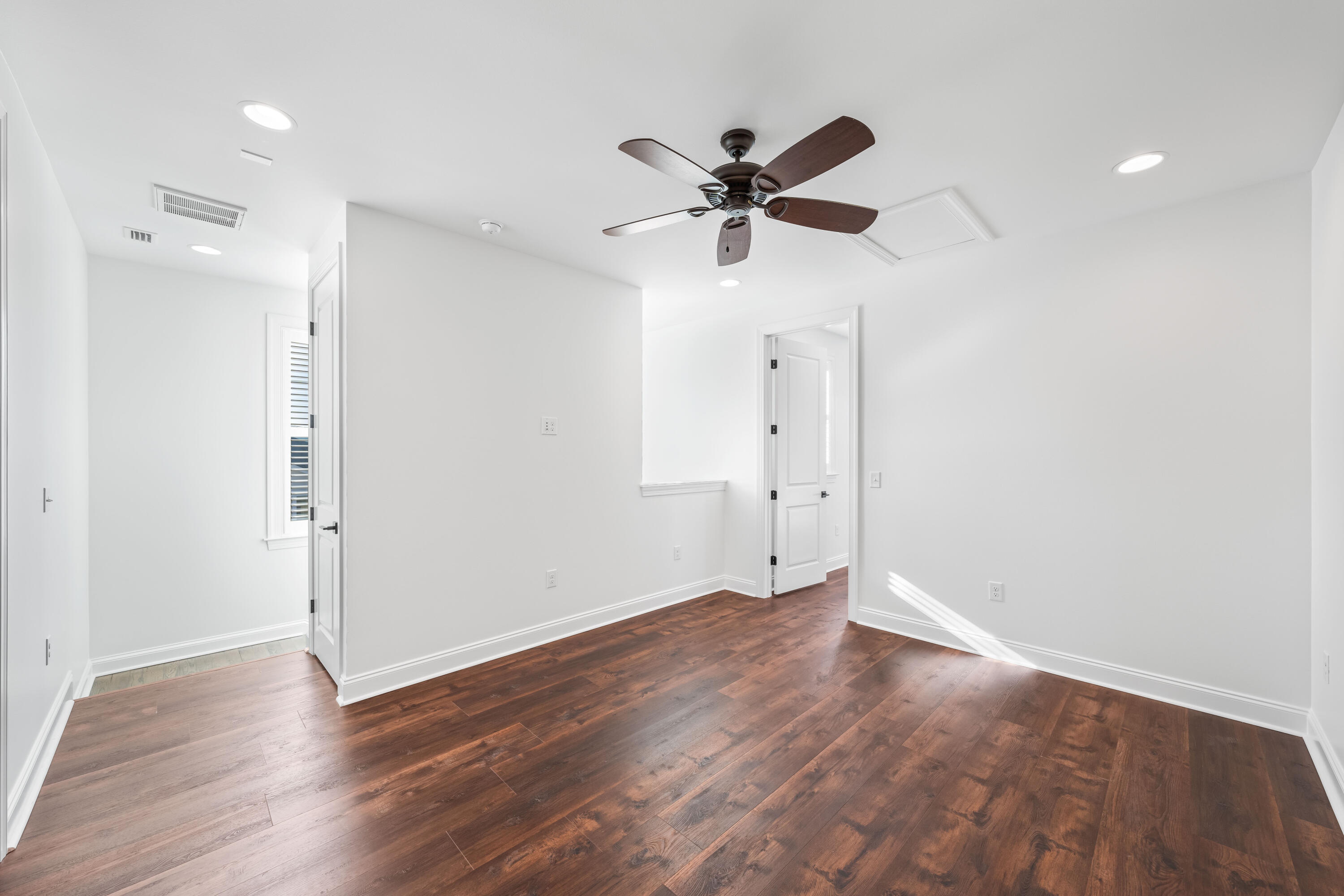 253 Windrow Way Watersound, FL 32461 - Photo 31 of 46 a view of an empty room with wooden floor