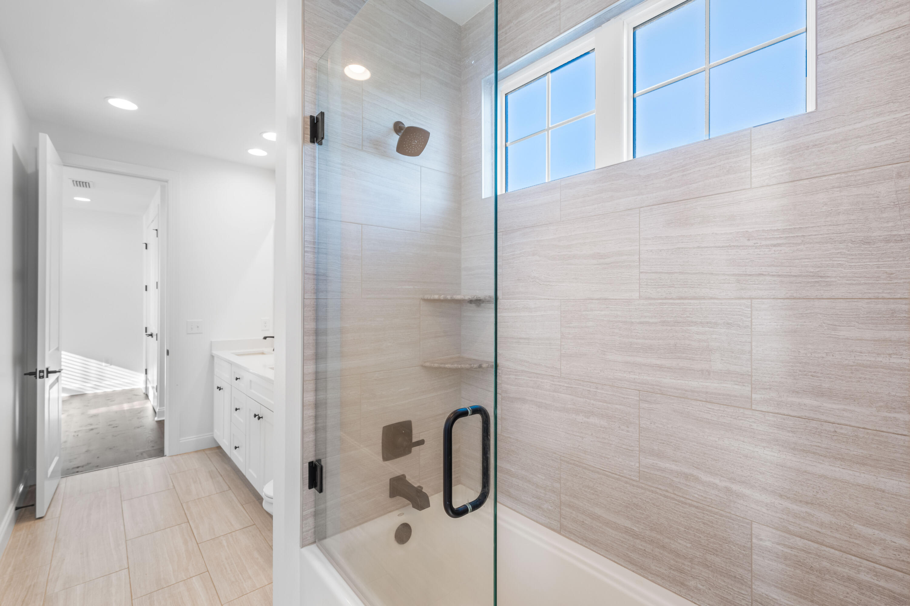 253 Windrow Way Watersound, FL 32461 - Photo 36 of 46 a bathroom with a bathtub and a shower