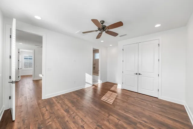 an empty room with ceiling fan
