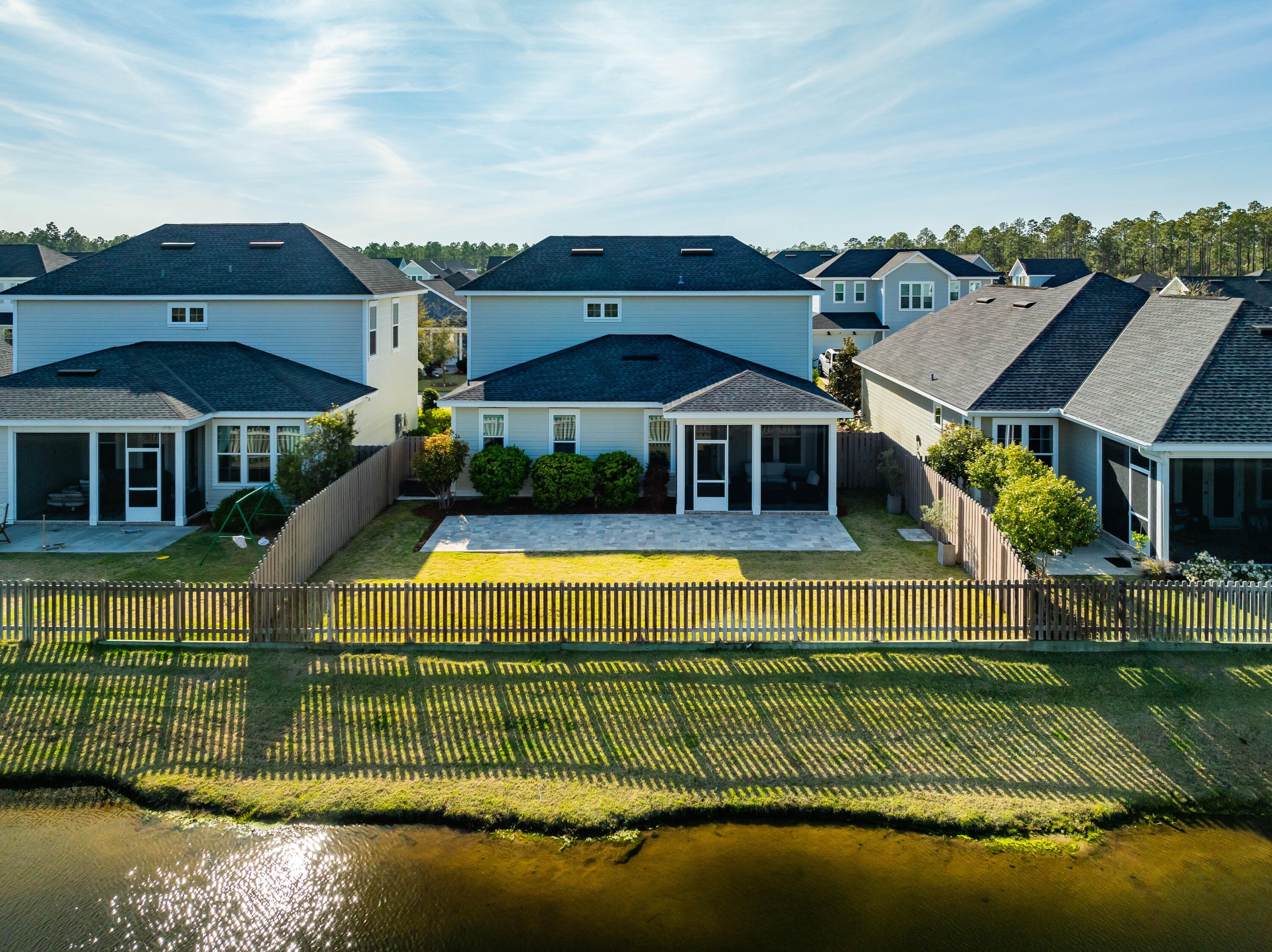 253 Windrow Way Watersound, FL 32461 - Photo 4 of 46 a front view of a house with a garden