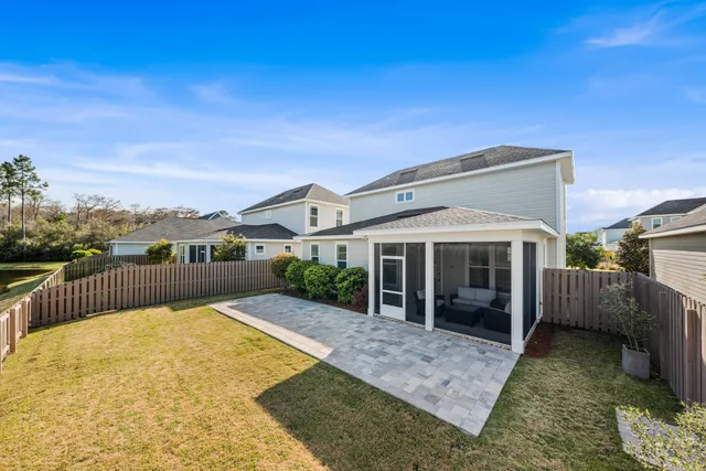 a view of a house with backyard and porch