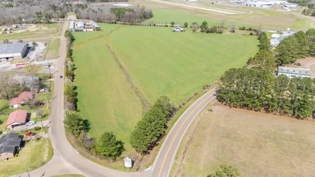 a view of a swimming pool with a yard