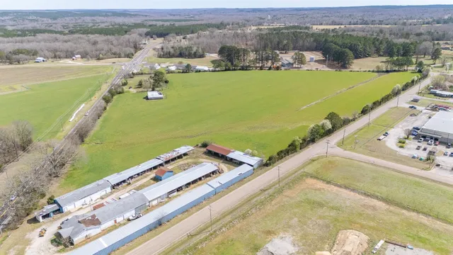an aerial view of a residential houses with outdoor space