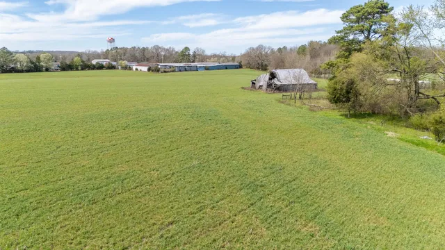 a view of a lake with houses in the back