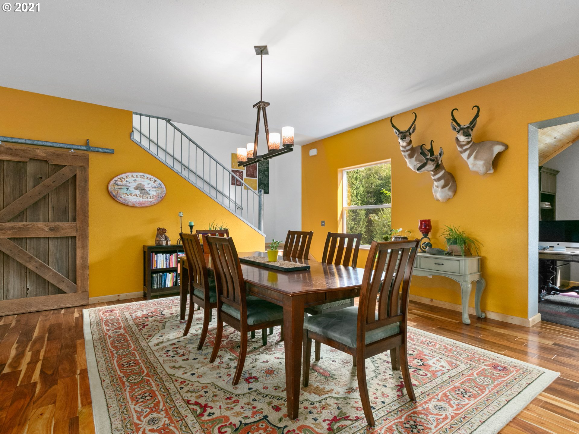 68507 Barton Road Rainier, OR 97048 - Photo 14 of 32 a view of a dining room with furniture window and wooden floor