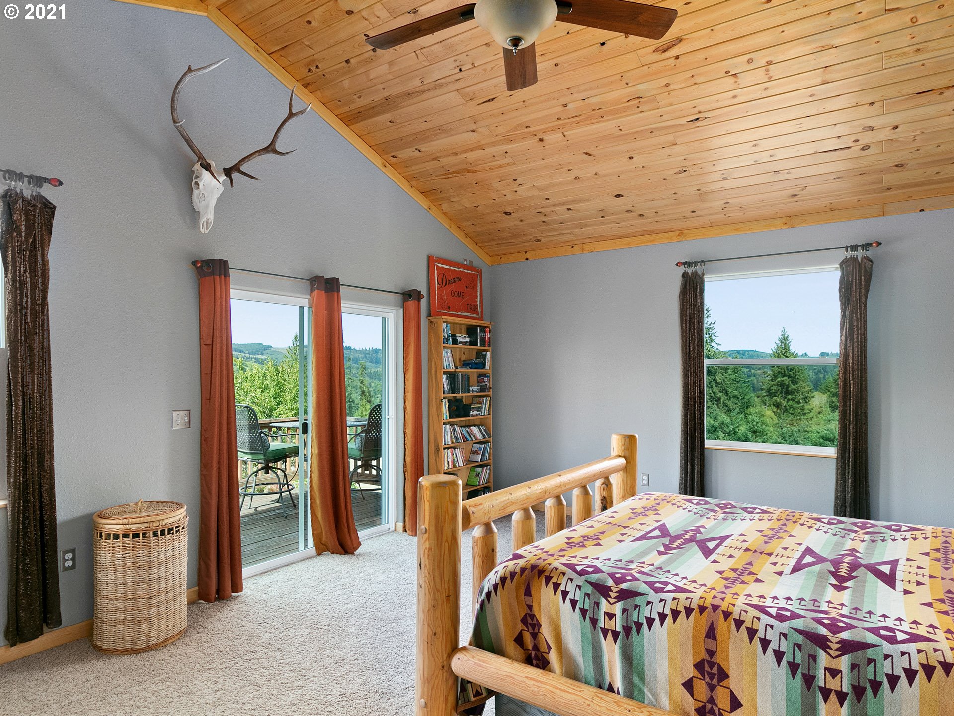 68507 Barton Road Rainier, OR 97048 - Photo 22 of 32 a bedroom with furniture and large windows
