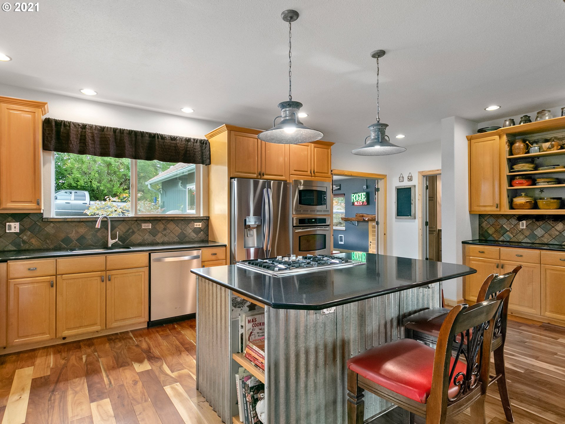 68507 Barton Road Rainier, OR 97048 - Photo 8 of 32 a kitchen with stainless steel appliances granite countertop a stove a sink and a wooden floors