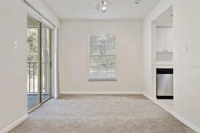 a kitchen with cabinets stainless steel appliances and a sink