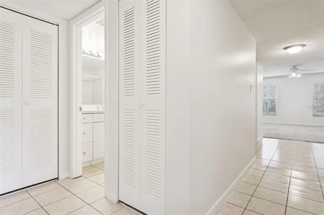 a bathroom with a granite countertop sink a toilet and mirror