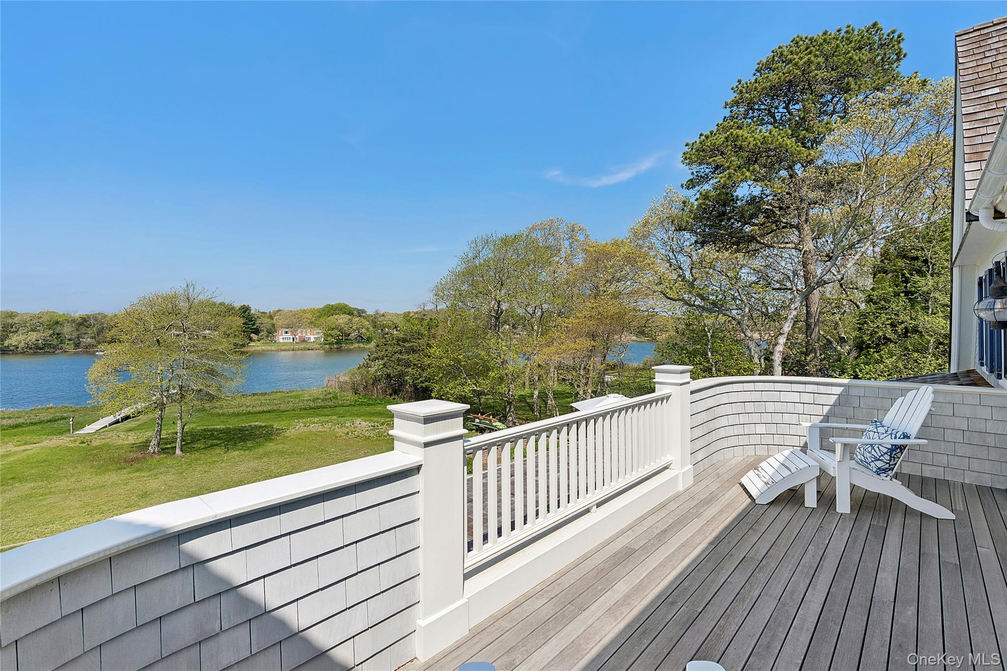 43 Old Main Road Quogue, NY 11959 - Photo 20 of 28 a view of a balcony with mountain view