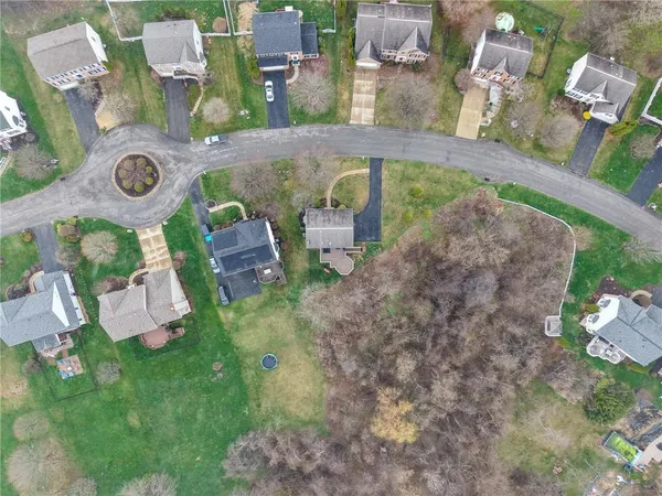an aerial view of a house with outdoor space
