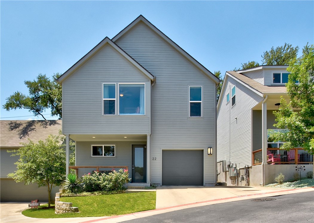 3001 Del Curto Road, Unit 22 Austin, TX 78704 - Photo 1 of 1 a front view of a house with a yard