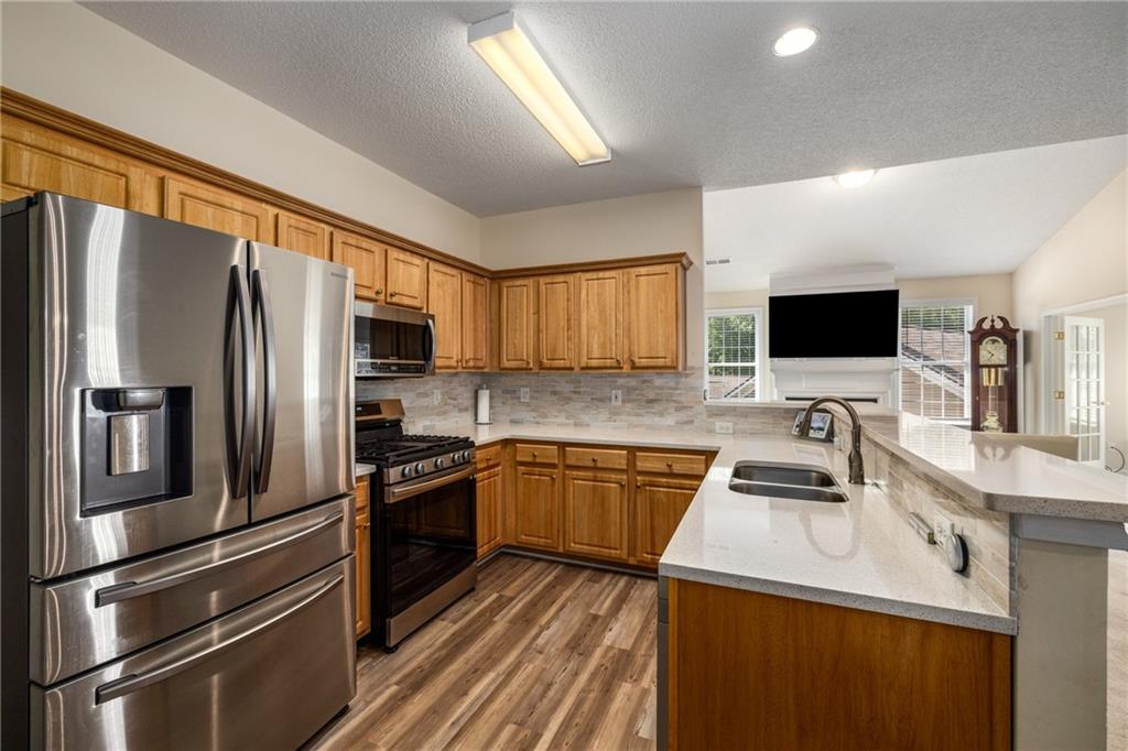 855 Camry Circle Dallas, GA 30157 - Photo 11 of 41 a kitchen with stainless steel appliances a refrigerator stove and microwave