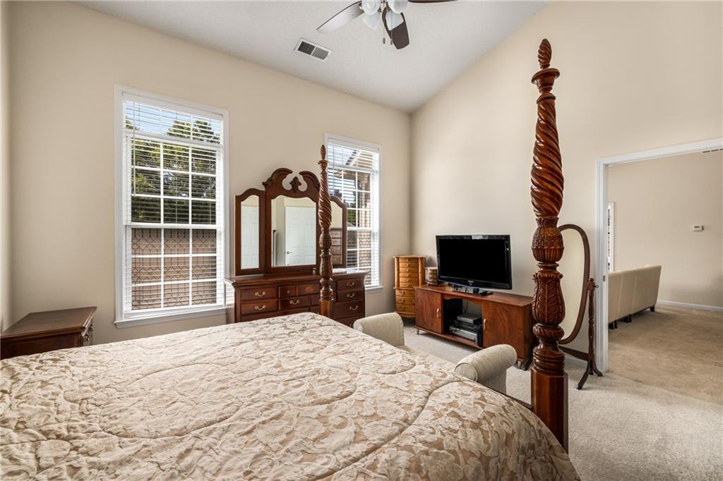 855 Camry Circle Dallas, GA 30157 - Photo 18 of 41 a bedroom with a bed and a flat tv screen on the dresser