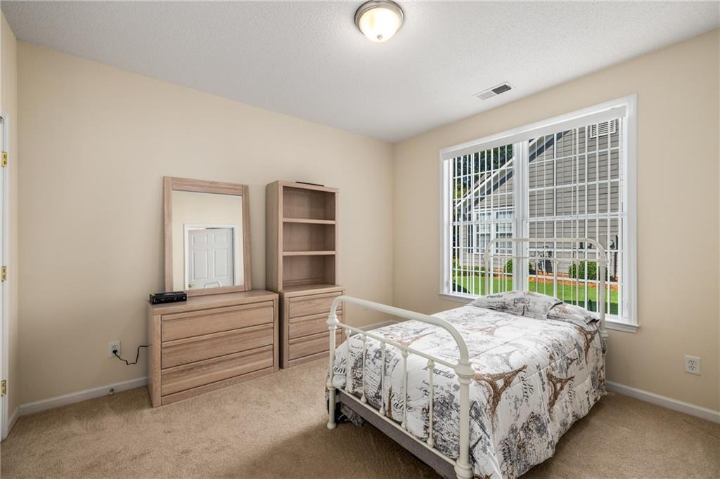 855 Camry Circle Dallas, GA 30157 - Photo 21 of 41 a bedroom with a bed and a window