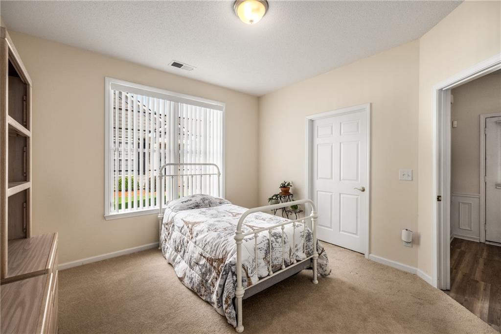 855 Camry Circle Dallas, GA 30157 - Photo 22 of 41 a bedroom with a bed and a window