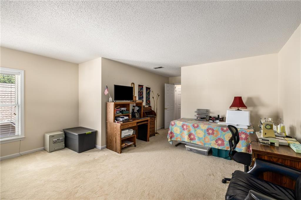 855 Camry Circle Dallas, GA 30157 - Photo 26 of 41 a bedroom with bed and a large window