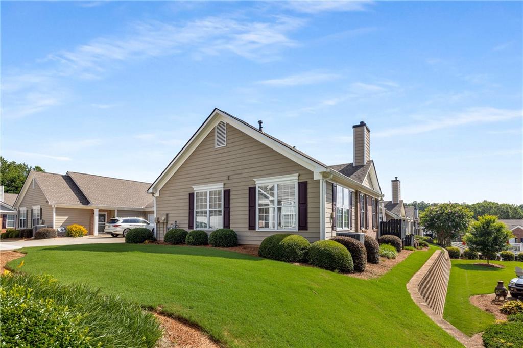 855 Camry Circle Dallas, GA 30157 - Photo 30 of 41 a view of a house with a big yard plants and large trees