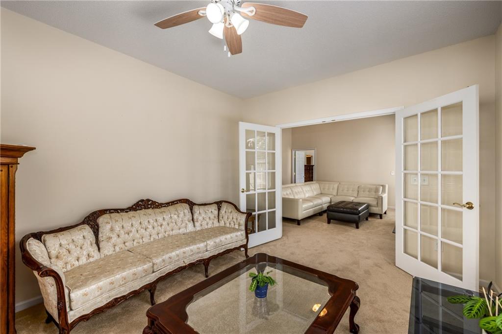 855 Camry Circle Dallas, GA 30157 - Photo 10 of 41 a living room with furniture and a chandelier