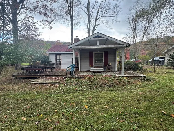 a backyard of a house with lots of green space