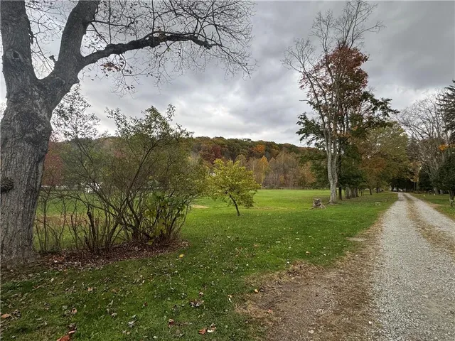 a view of a park with welcome board