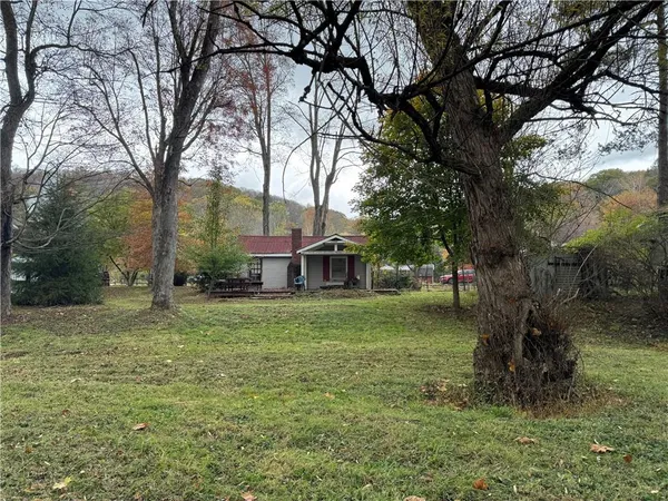 a view of a big yard next to a house