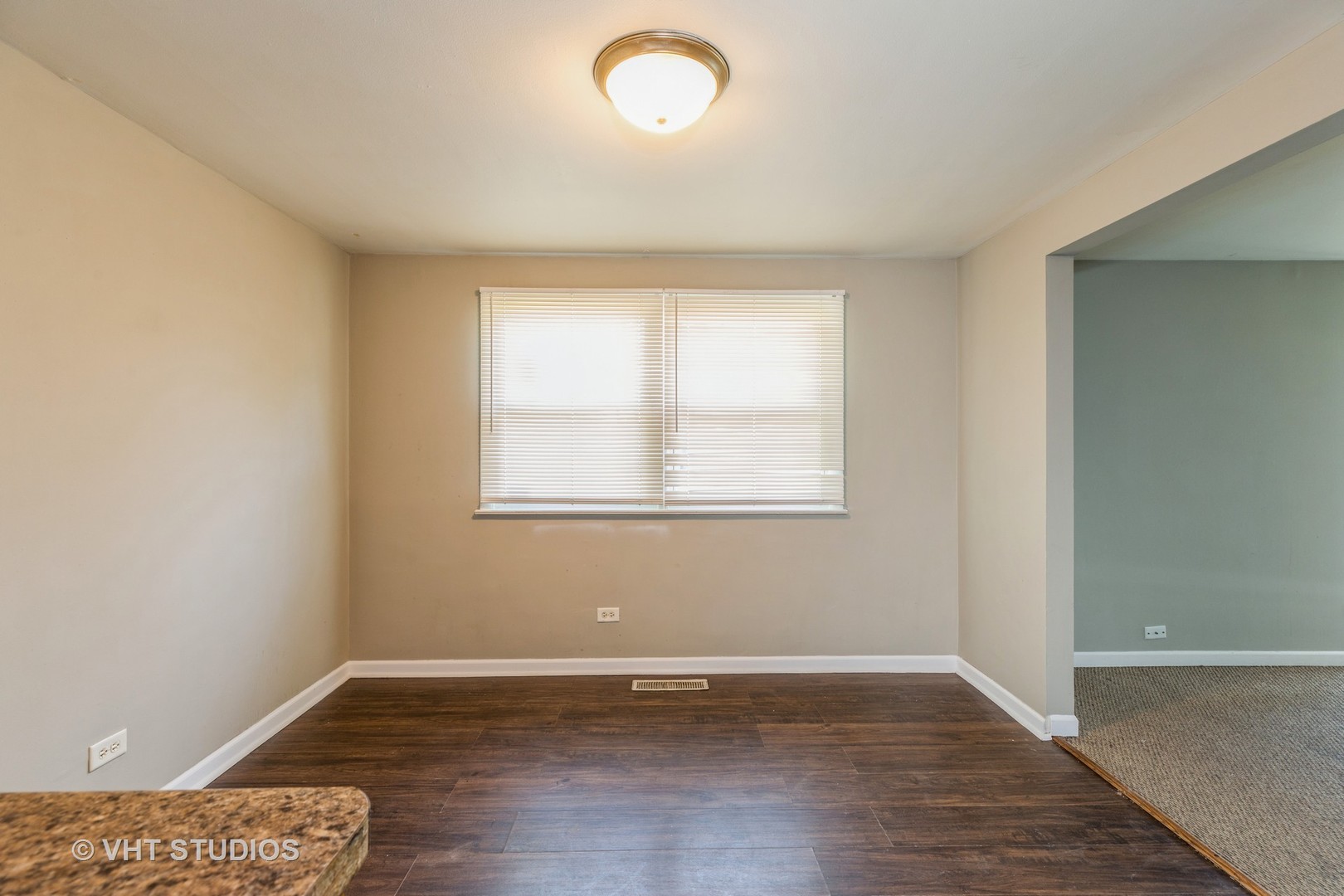 3941 169th Street Country Club Hills, IL 60478 - Photo 11 of 22 an empty room with wooden floor and windows