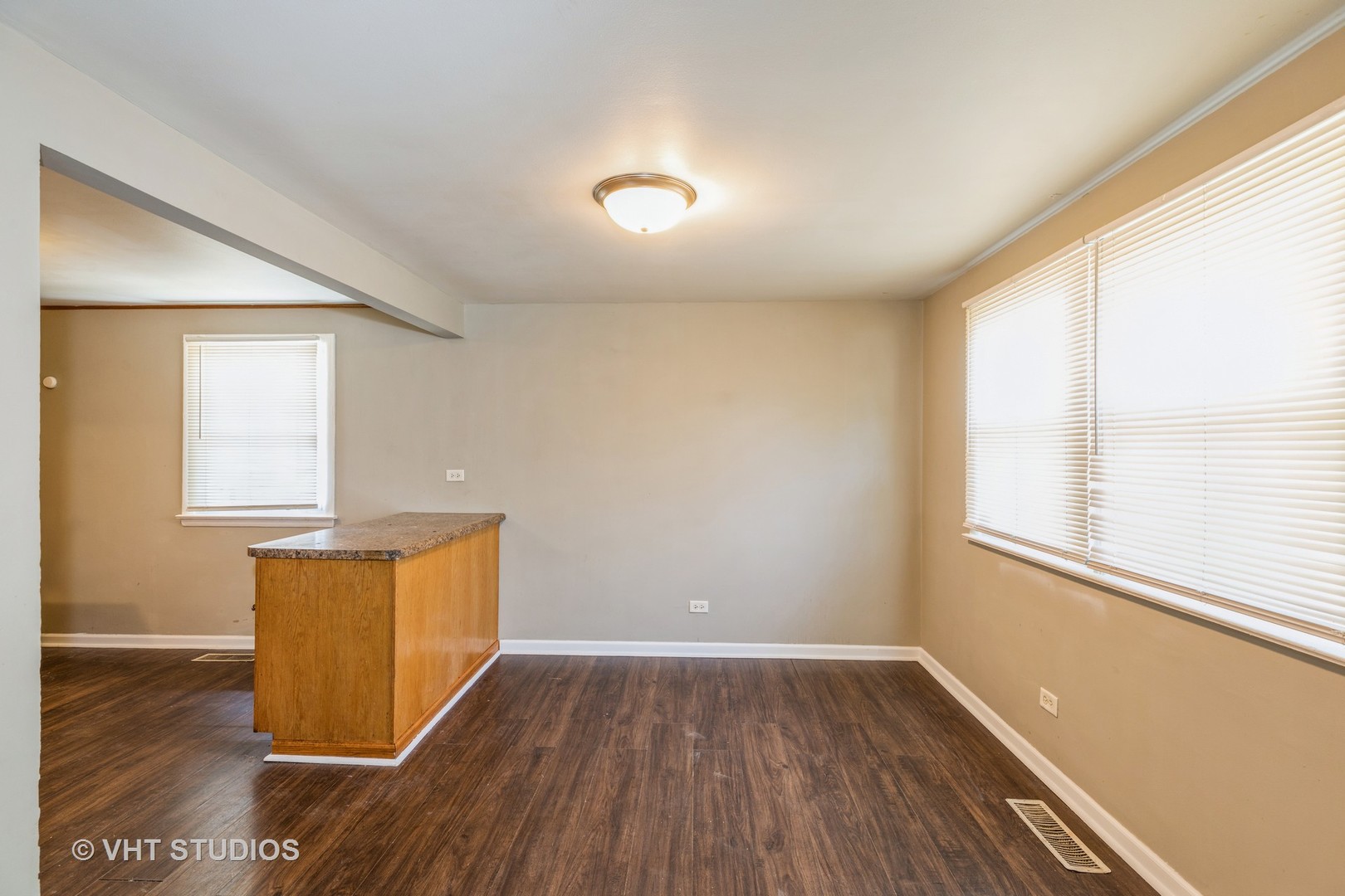 3941 169th Street Country Club Hills, IL 60478 - Photo 12 of 22 an empty room with wooden floor and windows